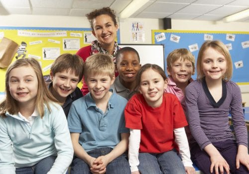 Schoolchildren In classroom with teacher